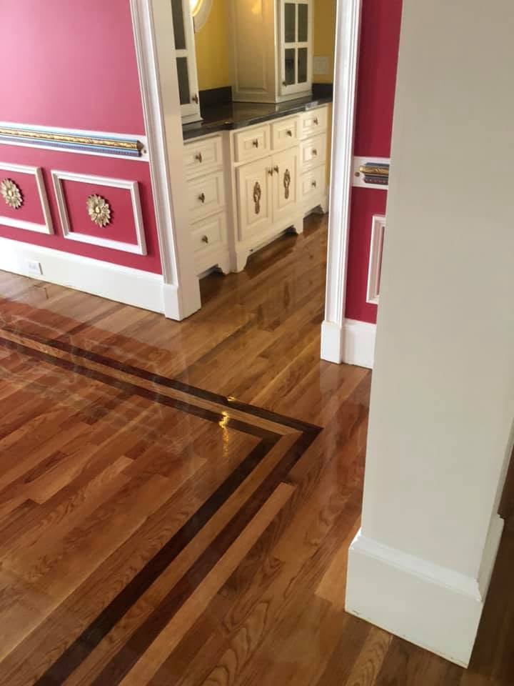 Custom dark stained inlay border detail in a refinished hardwood floor