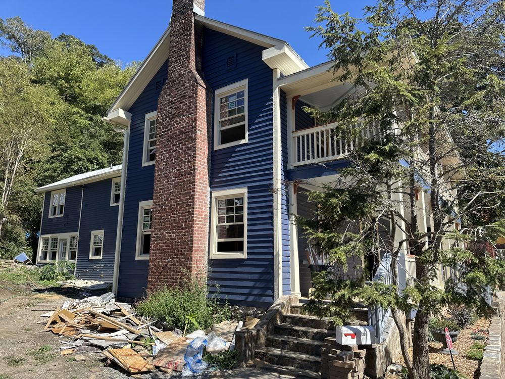 Exterior of a historic home during a full interior hardwood flooring project
